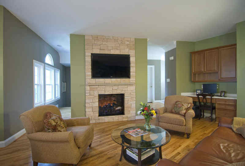 Stone veneer over gas fireplace-Adroit Design's interior remodeling services in Maryland and Virginia
