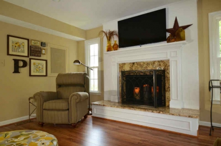 New mantel and mounted television-Adroit Design's interior remodeling services in Maryland and Virginia